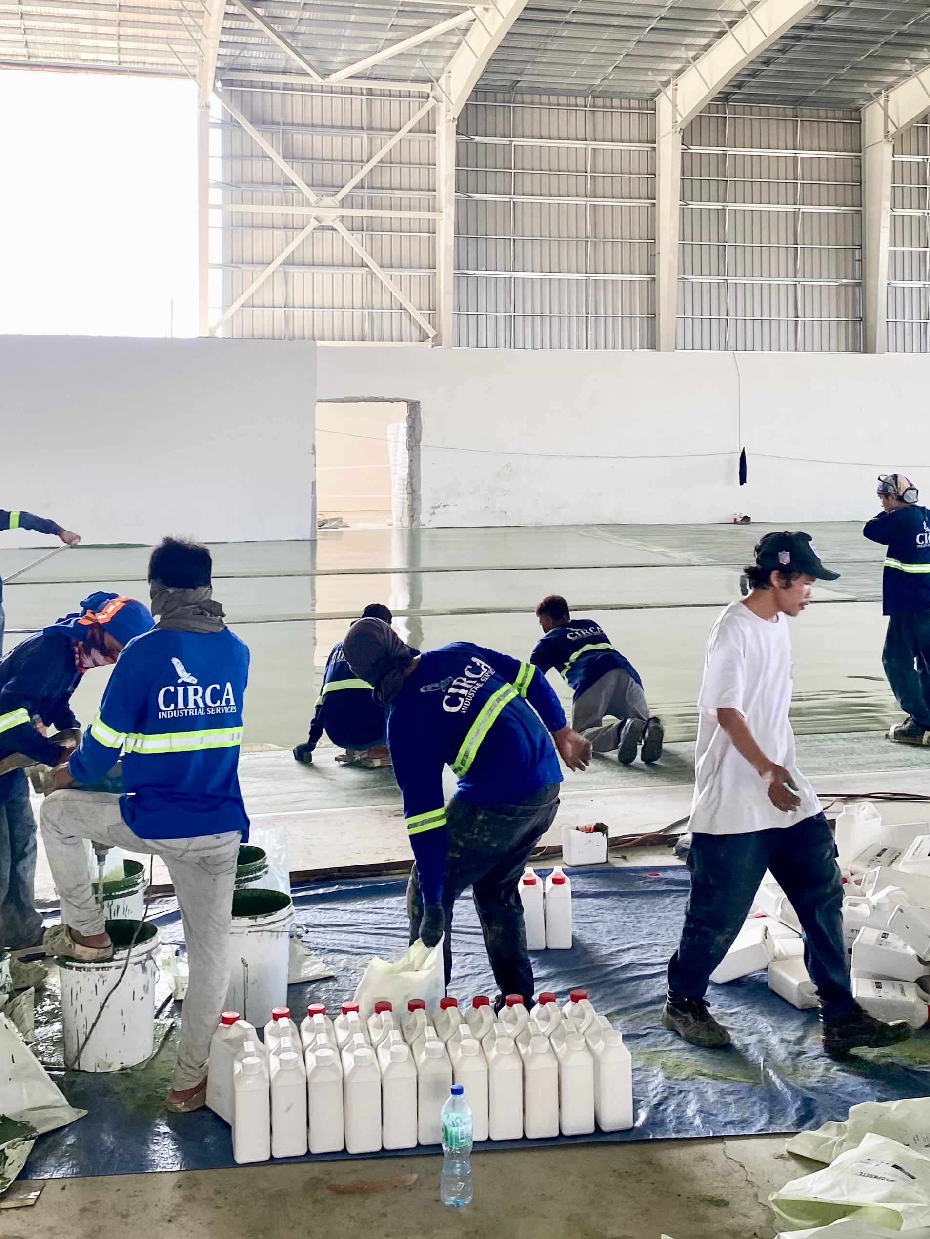 Industrial workers inspecting factory floor