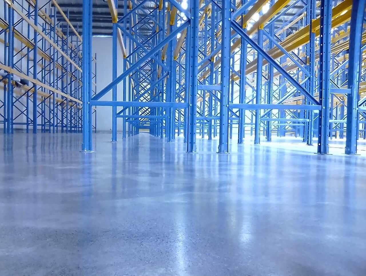 Flooring contractor applying epoxy coating